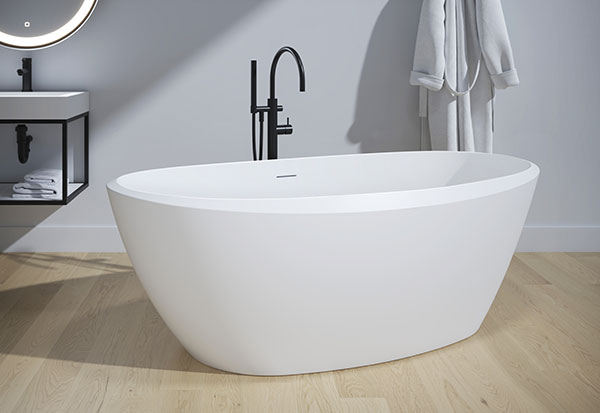 A freestanding solid surface bathtub from the aria stone collection by Fleurco