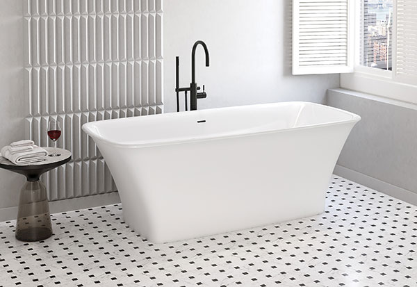 A matte white bathtub with a glossy white interior from the aria stone collection by Fleurco, standing out in a retro bathroom design. 