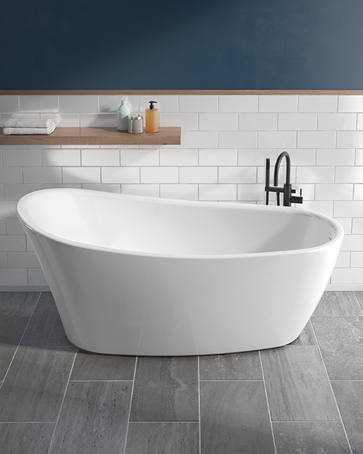 a single-ended freestanding tub in a cozy bathroom design